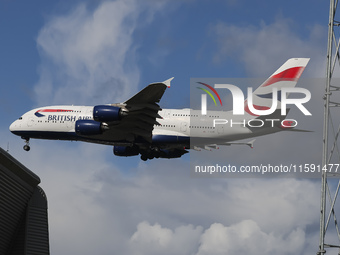 British Airways Airbus A380 Superjumbo passenger aircraft, spotted flying on final approach for landing on London Heathrow Airport runway in...