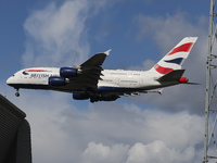 British Airways Airbus A380 Superjumbo passenger aircraft, spotted flying on final approach for landing on London Heathrow Airport runway in...