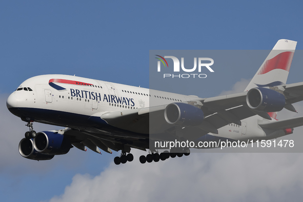 British Airways Airbus A380 Superjumbo passenger aircraft, spotted flying on final approach for landing on London Heathrow Airport runway in...