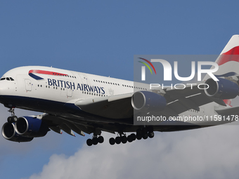 British Airways Airbus A380 Superjumbo passenger aircraft, spotted flying on final approach for landing on London Heathrow Airport runway in...