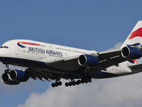 British Airways Airbus A380 Superjumbo passenger aircraft, spotted flying on final approach for landing on London Heathrow Airport runway in...