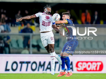 Duvan Zapata of Torino FC and Giangiacomo Magnani of Hellas Verona compete for the ball during the Serie A Enilive match between Hellas Vero...