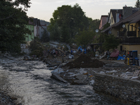 Morawka river flows by debris and damaged houses left by the flood in Stronie Slaskie, Poland on September 20, 2024. (