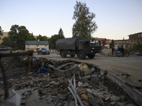 A truck of the Polish armed forces passes by debris left by flood waters in Stronie Slaskie, Poland on September 20, 2024. (