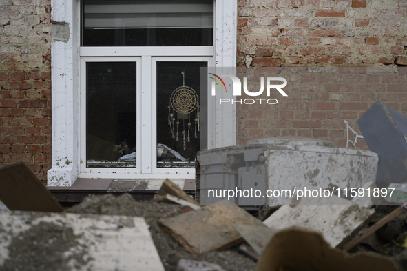 Debris left by the flood are amassed outside a damaged house in Stronie Slaskie, Poland on September 20, 2024. 