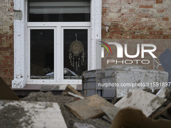 Debris left by the flood are amassed outside a damaged house in Stronie Slaskie, Poland on September 20, 2024. (