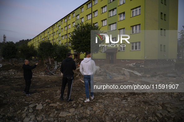 People look at the damages left by the flood that hit the town of Stronie Slaskie, Poland on September 20, 2024. 