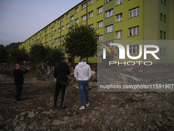 People look at the damages left by the flood that hit the town of Stronie Slaskie, Poland on September 20, 2024. (