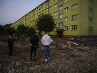 People look at the damages left by the flood that hit the town of Stronie Slaskie, Poland on September 20, 2024. (