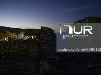 Heavily damaged buildings are seen at sunset after a flood hit the town of Stronie Slaskie, Poland on September 20, 2024. (