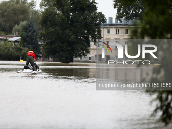 A rescuer with a motorboat operates in flooded areas of the city due to the flooding of the Odra River in Brzeg, Poland, on September 19, 20...