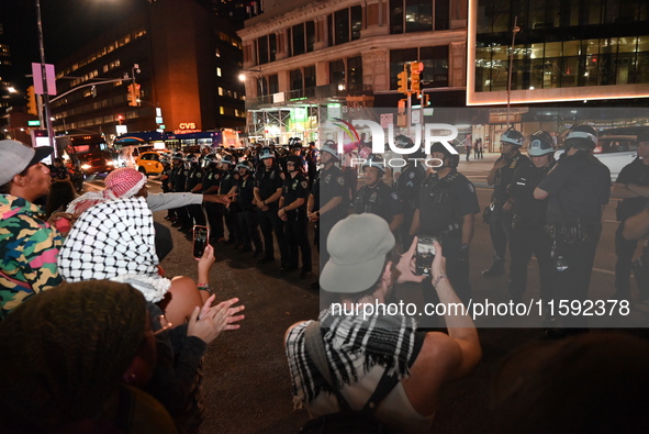 Protesters face off with the police. Protesters demonstrate and make their voices heard for black and Palestinian liberation following the S...