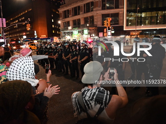 Protesters face off with the police. Protesters demonstrate and make their voices heard for black and Palestinian liberation following the S...