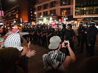 Protesters face off with the police. Protesters demonstrate and make their voices heard for black and Palestinian liberation following the S...