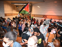 Protesters inside the Dekalb Avenue subway demonstrate for Black and Palestinian liberation following the subway shooting in Brooklyn, strik...