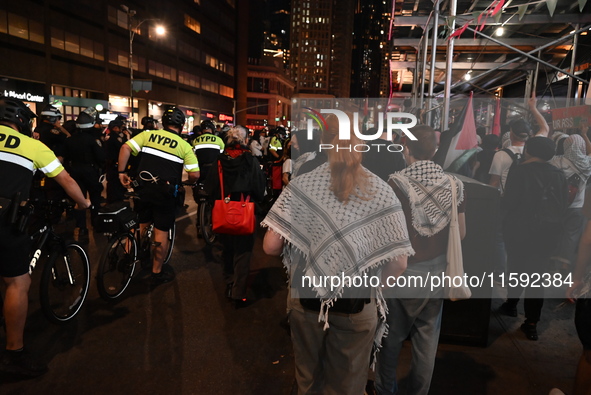 Protesters march while police follow. Protesters demonstrate and make their voices heard for Black and Palestinian liberation following the...