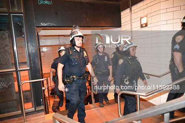 Police guard the subway. Protesters demonstrate and make their voices heard for black and Palestinian liberation following the subway shooti...