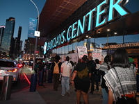 Protesters demonstrate by Barclays Center. Protesters make their voices heard for black and Palestinian liberation following the subway shoo...