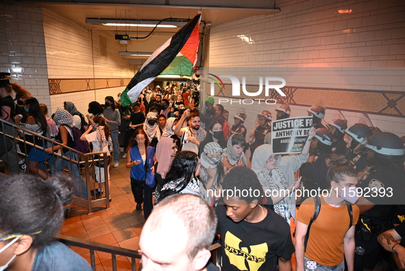 Protesters demonstrate inside a subway. Protesters demonstrate and make their voices heard for Black and Palestinian liberation following th...