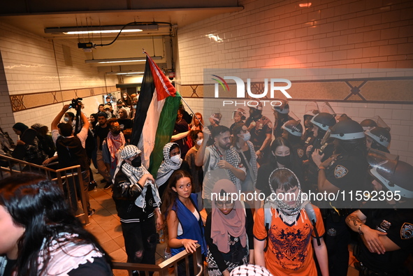 Protesters inside the subway. Protesters demonstrate and make their voices heard for black and Palestinian liberation following the subway s...