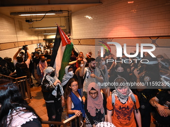 Protesters inside the subway. Protesters demonstrate and make their voices heard for black and Palestinian liberation following the subway s...