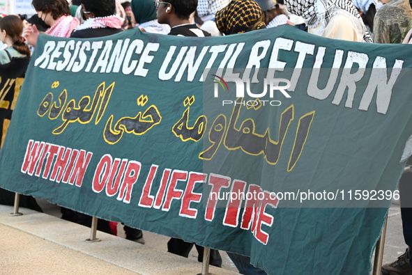 A sign says ''resistance.'' Protesters demonstrate and make their voices heard for Black and Palestinian liberation following the subway sho...