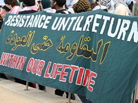 A sign says ''resistance.'' Protesters demonstrate and make their voices heard for Black and Palestinian liberation following the subway sho...