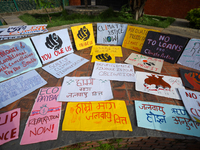 Placards display slogans calling for climate justice during an event to mark Global Week of Action for Peace and Climate Justice in Lalitpur...