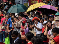 The residents watch the 'Gotong Toapekong' (Carrying Toapekong) tradition in Tangerang, Banten Province, Indonesia, on September 21, 2024. T...