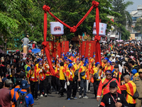 The atmosphere of the 'Gotong Toapekong' (Carrying Toapekong) tradition in Tangerang, Banten Province, Indonesia, on September 21, 2024. Thi...