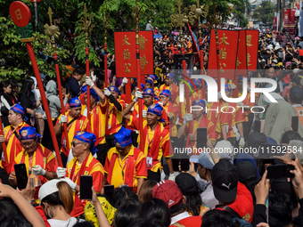 The atmosphere of the 'Gotong Toapekong' (Carrying Toapekong) tradition in Tangerang, Banten Province, Indonesia, on September 21, 2024. Thi...