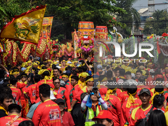 The atmosphere of the 'Gotong Toapekong' (Carrying Toapekong) tradition in Tangerang, Banten Province, Indonesia, on September 21, 2024. Thi...