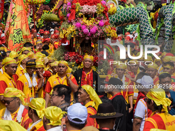 The atmosphere of the 'Gotong Toapekong' (Carrying Toapekong) tradition in Tangerang, Banten Province, Indonesia, on September 21, 2024. Thi...