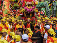 The atmosphere of the 'Gotong Toapekong' (Carrying Toapekong) tradition in Tangerang, Banten Province, Indonesia, on September 21, 2024. Thi...