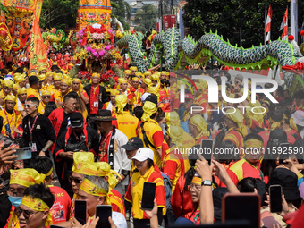 The atmosphere of the 'Gotong Toapekong' (Carrying Toapekong) tradition in Tangerang, Banten Province, Indonesia, on September 21, 2024. Thi...