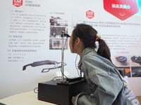 A child uses ''AR smart glasses'' during the 2024 National Science Popularization Day in Beijing, China, on September 21, 2024. (