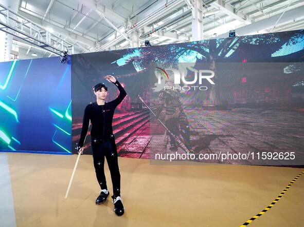 Actors demonstrate scenes for the production of ''Black Myth: Wukong'' through motion capture technology during the event of the 2024 Nation...