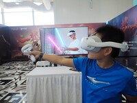 A child experiences a ''VR game'' during the 2024 National Science Popularization Day in Beijing, China, on September 21, 2024. (