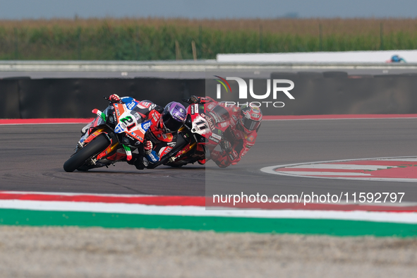 Michael Ruben Rinaldi from Italy of Team Motocorsa Racing rides a Ducati Panigale V4R, followed by Nicolo Bulega from Italy of Aruba.it Duca...