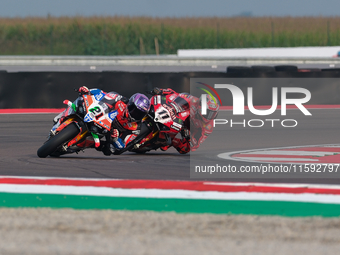 Michael Ruben Rinaldi from Italy of Team Motocorsa Racing rides a Ducati Panigale V4R, followed by Nicolo Bulega from Italy of Aruba.it Duca...