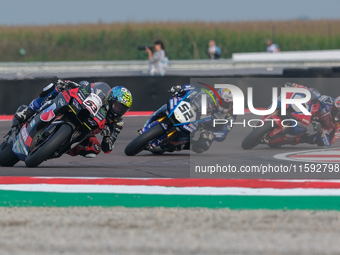 Tito Rabat from Spain of Kawasaki Puccetti Racing rides a Kawasaki ZX-10RR, followed by Alessandro Delbianco from Italy of Yamaha Motoxracin...