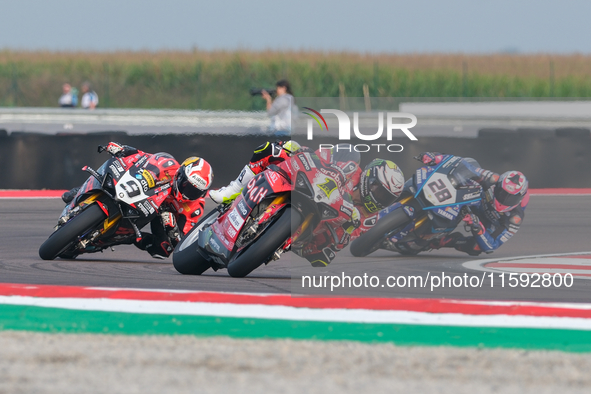 Alvaro Bautista from Spain of the Aruba.it Ducati Team rides a Ducati Panigale V4R, and Danilo Petrucci from Italy of the Brani Spark Racing...