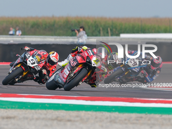 Alvaro Bautista from Spain of the Aruba.it Ducati Team rides a Ducati Panigale V4R, and Danilo Petrucci from Italy of the Brani Spark Racing...