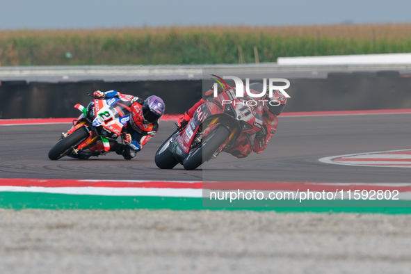 Nicolo Bulega from Italy of Aruba.it Ducati Team rides a Ducati Panigale V4R, followed by Michael Ruben Rinaldi from Italy of Team Motocorsa...