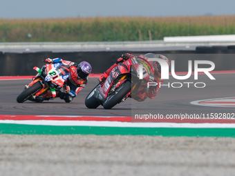 Nicolo Bulega from Italy of Aruba.it Ducati Team rides a Ducati Panigale V4R, followed by Michael Ruben Rinaldi from Italy of Team Motocorsa...