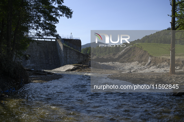 A dam with a damaged embankment that caused the heavy flooding of the town of Stronie Slaskie and other towns located downstream of the Mora...