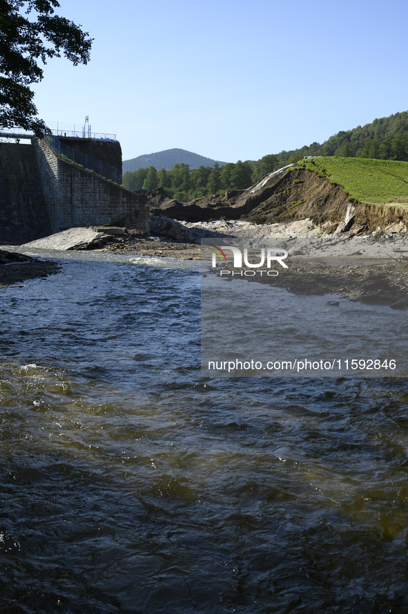 A dam with a damaged embankment that caused the heavy flooding of the town of Stronie Slaskie and other towns located downstream of the Mora...