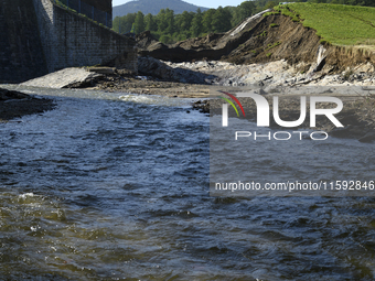 A dam with a damaged embankment that caused the heavy flooding of the town of Stronie Slaskie and other towns located downstream of the Mora...