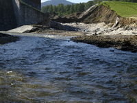 A dam with a damaged embankment that caused the heavy flooding of the town of Stronie Slaskie and other towns located downstream of the Mora...