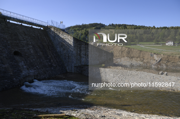 A dam with a damaged embankment that caused the heavy flooding of the town of Stronie Slaskie and other towns located downstream of the Mora...